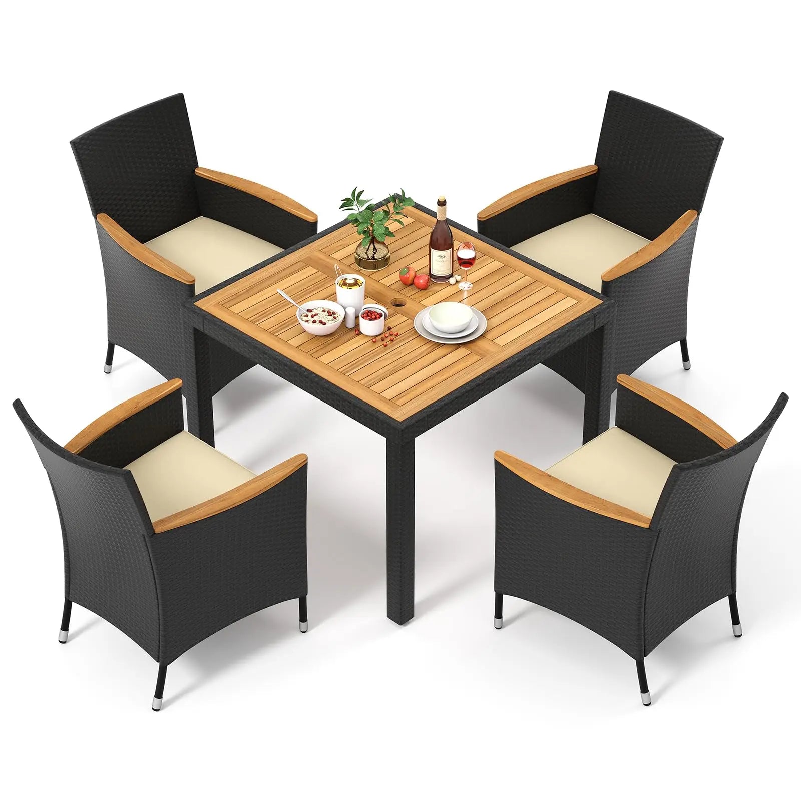 Modern rattan garden furniture set placed in a lush green backyard with soft lighting.