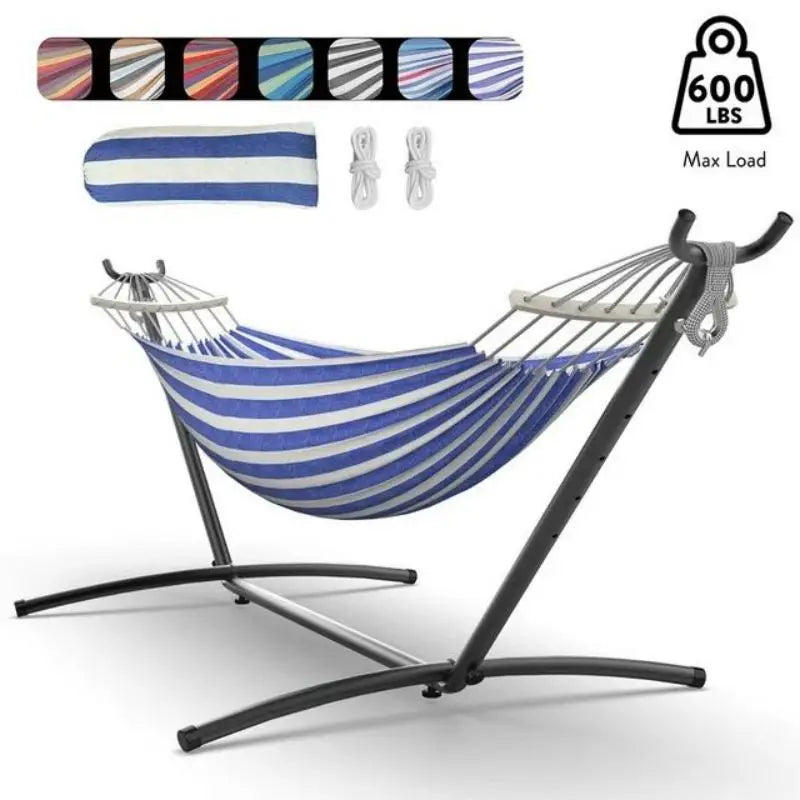 Relaxing hammock on beach with sunset background light blue color