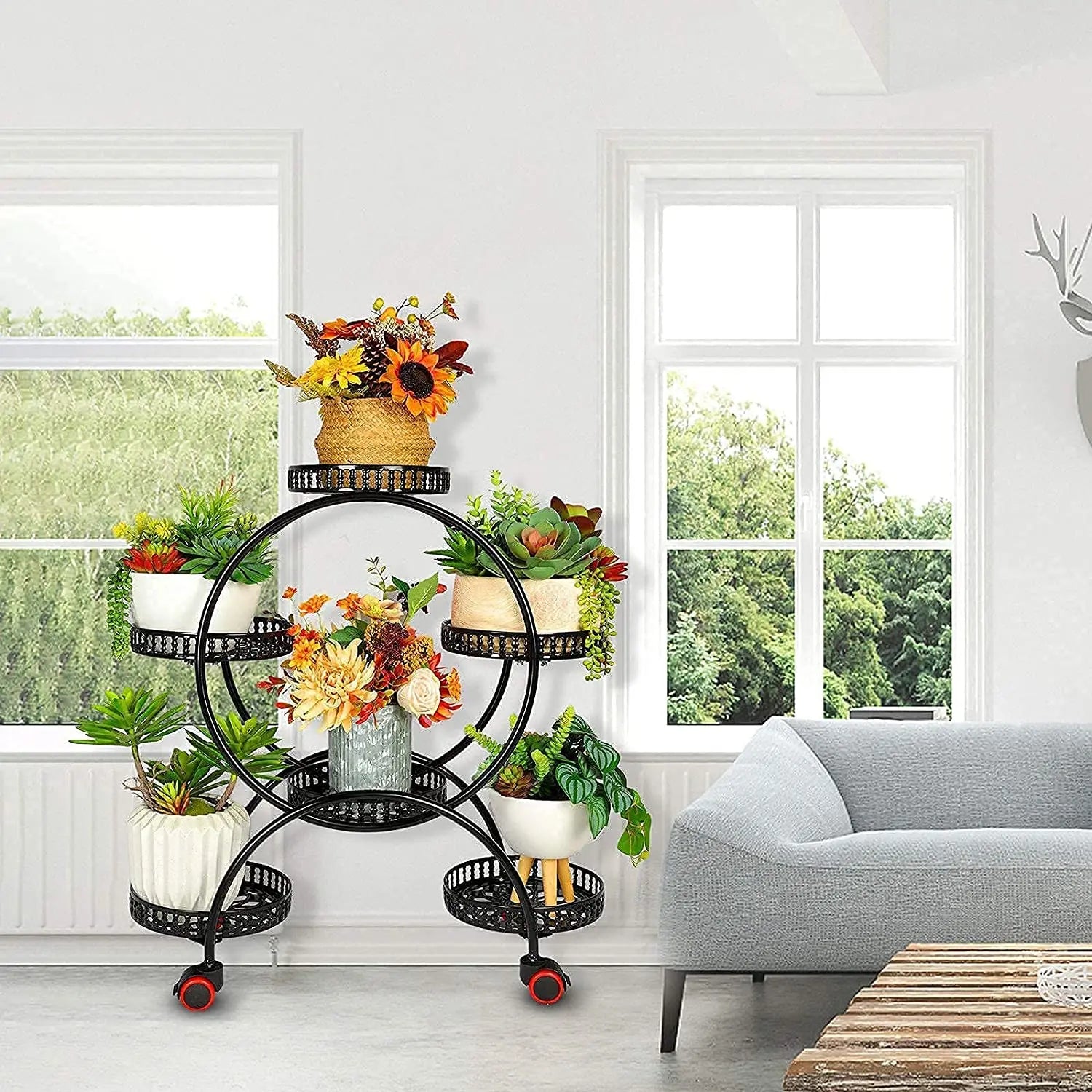 Multi-tier plant stand displaying succulents and decorative pots