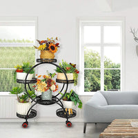 Multi-tier plant stand displaying succulents and decorative pots