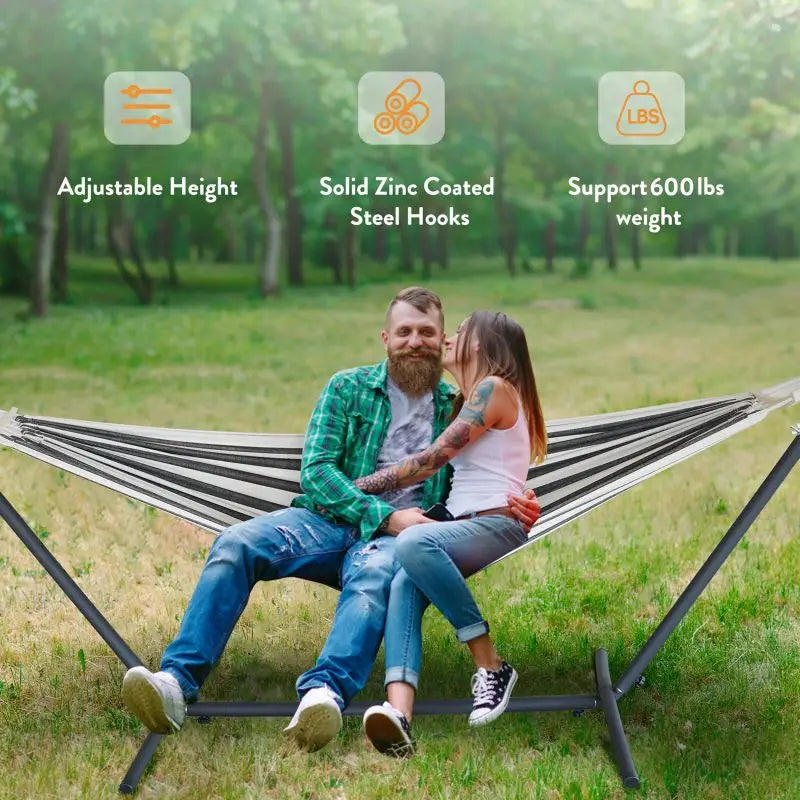 Comfortable outdoor hammock hanging between trees in garden