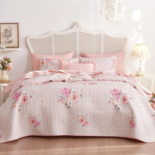 Bedding set- light pink floral design in a cozy bedroom setting 