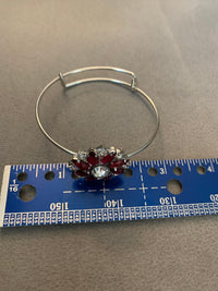 Red an clear rhinestone bangle bracelet. Adjustable to fit any wrist size