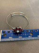 Red an clear rhinestone bangle bracelet. Adjustable to fit any wrist size
