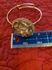 Elegant Rhinestone and gold bangle bracelet. Adjustable to fit any wrist size
