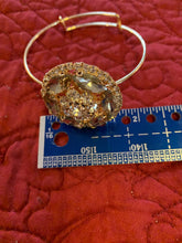 Elegant Rhinestone and gold bangle bracelet. Adjustable to fit any wrist size