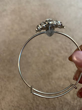 Elegant rhinestone bangle bracelet. Adjustable to fit any wrist size