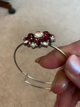 Red an clear rhinestone bangle bracelet. Adjustable to fit any wrist size