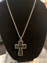 Mens silver cross with black embossed leather center necklace.