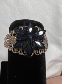 Silver Filigree Bracelet: Blue Rhinestone Starburst Jewel, Adjustable Bangle