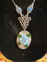 Oval stone clay earring and necklace set with blue petal flowers