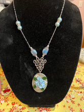Oval stone clay earring and necklace set with blue petal flowers