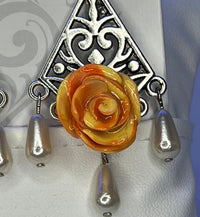 Handmade orange and yellow mixed clay rose earrings on silver chandelier base
