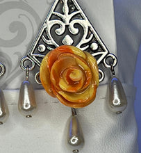 Handmade orange and yellow mixed clay rose earrings on silver chandelier base