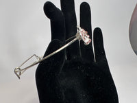 Silver crown with pink rhinestone embellishment on a silver wire bracelet. Princess. Adjustable. Favored one