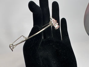 Silver crown with pink rhinestone embellishment on a silver wire bracelet. Princess. Adjustable. Favored one