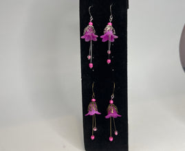 Hand painted lucite flower earring sets in varied colors