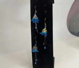 Hand painted lucite flower earring sets in varied colors