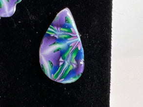 Stained glass looking or kaleidoscope style stud earrings made of clay
