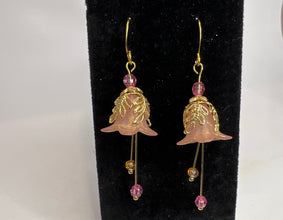 Hand painted lucite flower earring sets in varied colors