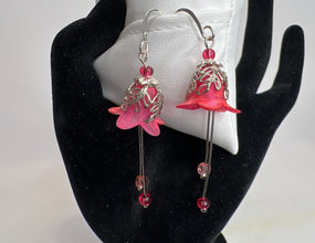 Hand painted lucite flower earring sets in varied colors