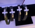 Men’s leather bracelets with cross slider. Varied colors and sizes.
