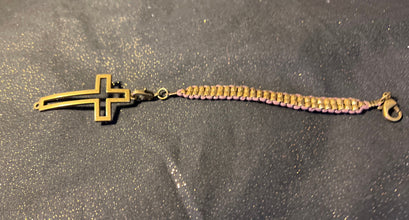 Bronze cross bracelet on metal beaded band.