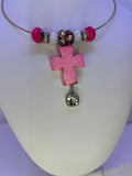 Pink cross necklace on gold plated wire with added bling