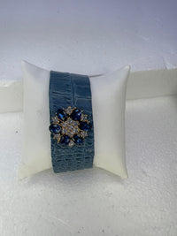 Leather bracelets in blue or cream color with blue and clear floral rhinestone embellishment
