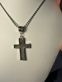 Silver plated crosses with embossed leather inside on various chains. Necklaces of faith.
