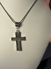 Silver plated crosses with embossed leather inside on various chains. Necklaces of faith.