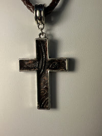 Silver plated crosses with embossed leather inside on various chains. Necklaces of faith.