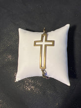 Bronze cross bracelet on metal beaded band.