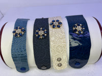 Leather bracelets in blue or cream color with blue and clear floral rhinestone embellishment