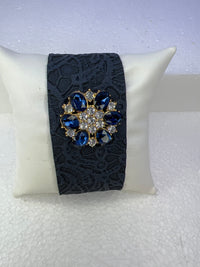 Leather bracelets in blue or cream color with blue and clear floral rhinestone embellishment