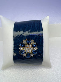 Leather bracelets in blue or cream color with blue and clear floral rhinestone embellishment