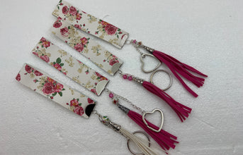 Embossed and patterned leather wrist holder key chains