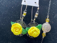 Handmade yellow polymer clay rose necklace and earring set. Black chain and accent pieces