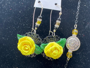 Handmade yellow polymer clay rose necklace and earring set. Black chain and accent pieces