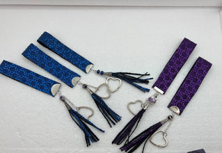 Embossed and patterned leather wrist holder key chains