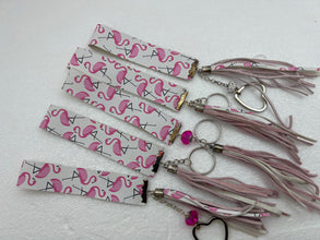 Embossed and patterned leather wrist holder key chains