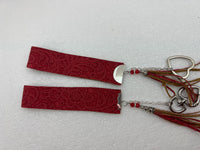 Embossed and patterned leather wrist holder key chains