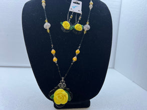Handmade yellow polymer clay rose necklace and earring set. Black chain and accent pieces