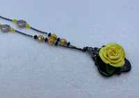 Handmade yellow polymer clay rose necklace and earring set. Black chain and accent pieces
