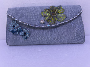 Silver grey patterned leather wallet adorned with floral bling and leather lining
