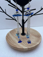 Hand painted lucite daisies in a Victorian style setting with dangling flowers earrings