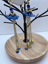 Hand painted lucite daisies in a Victorian style setting with dangling flowers earrings