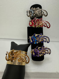 Peacock adorned bracelets in multi colors on gold or bronze adjustable bases