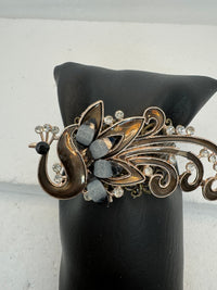 Peacock adorned bracelets in multi colors on gold or bronze adjustable bases