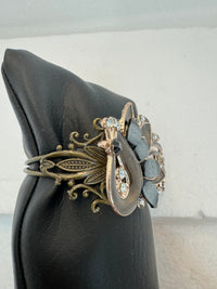 Peacock adorned bracelets in multi colors on gold or bronze adjustable bases